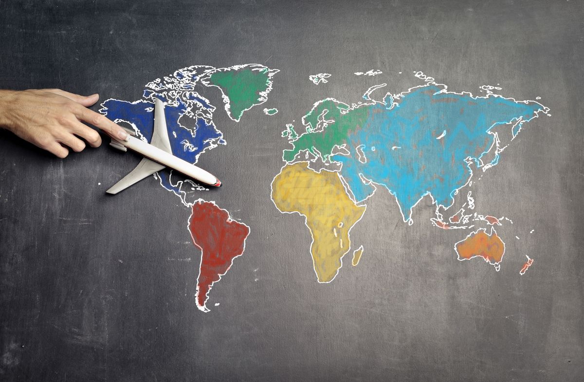 World map and aeroplane for an overseas journey