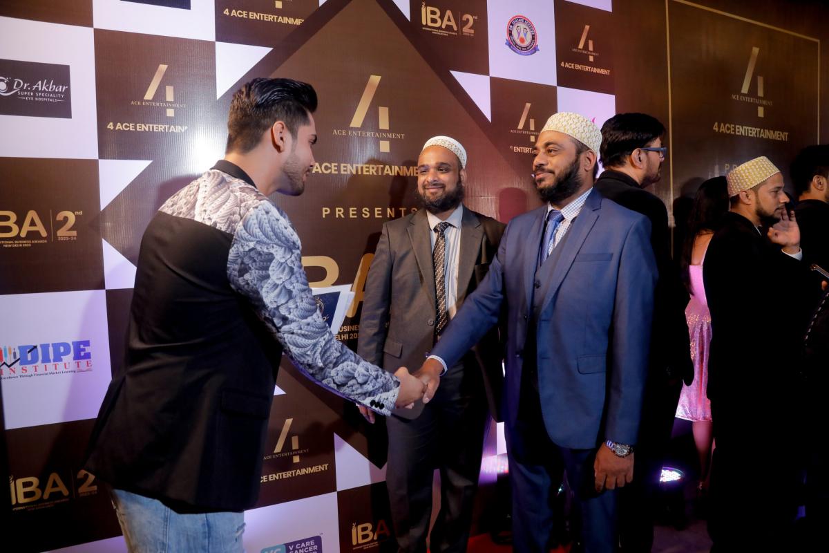 Trans Globe Indore representative greeting a guest at the International Business Awards