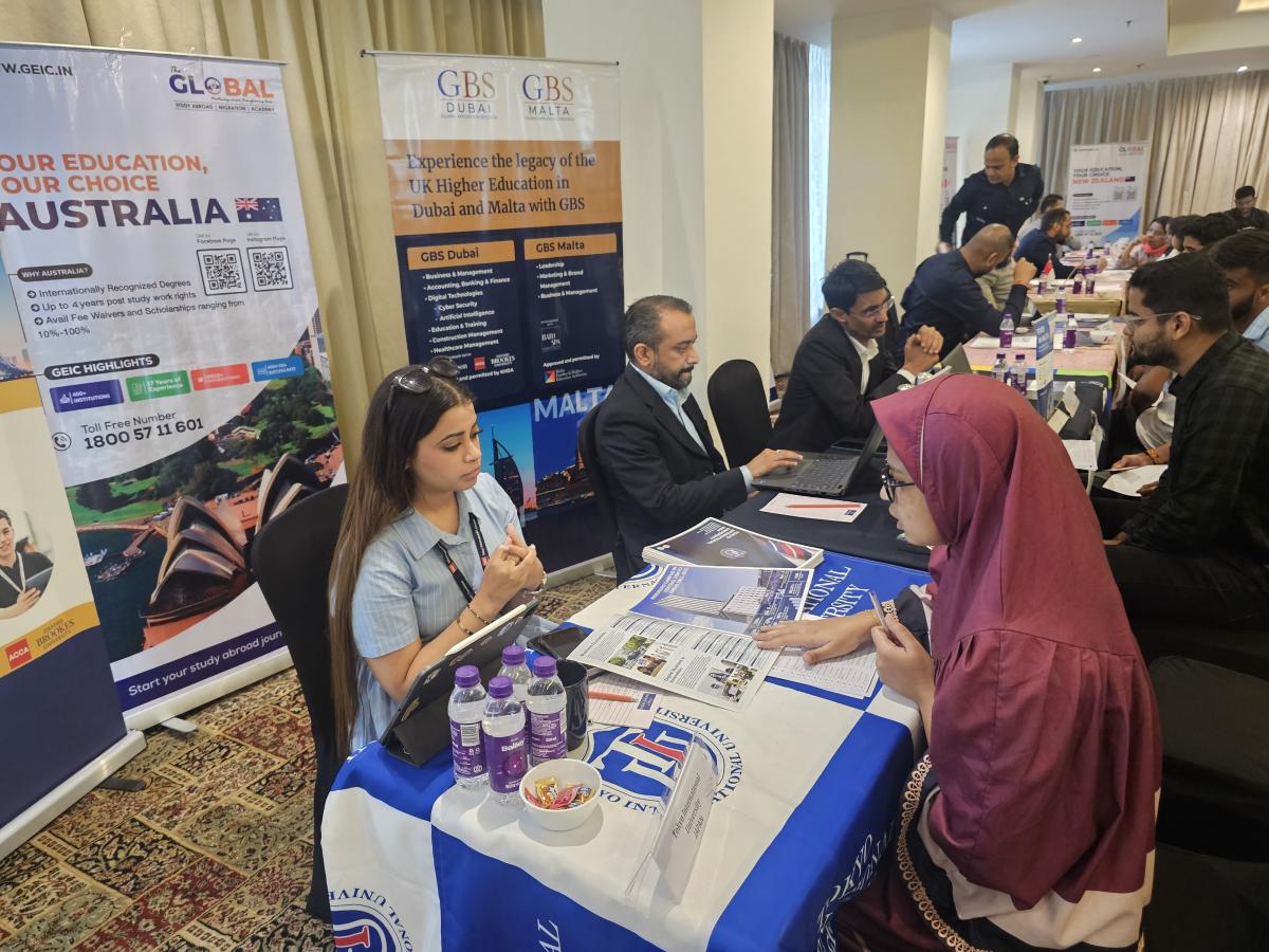 University representatives explaining study options at the Trans Globe Indore event