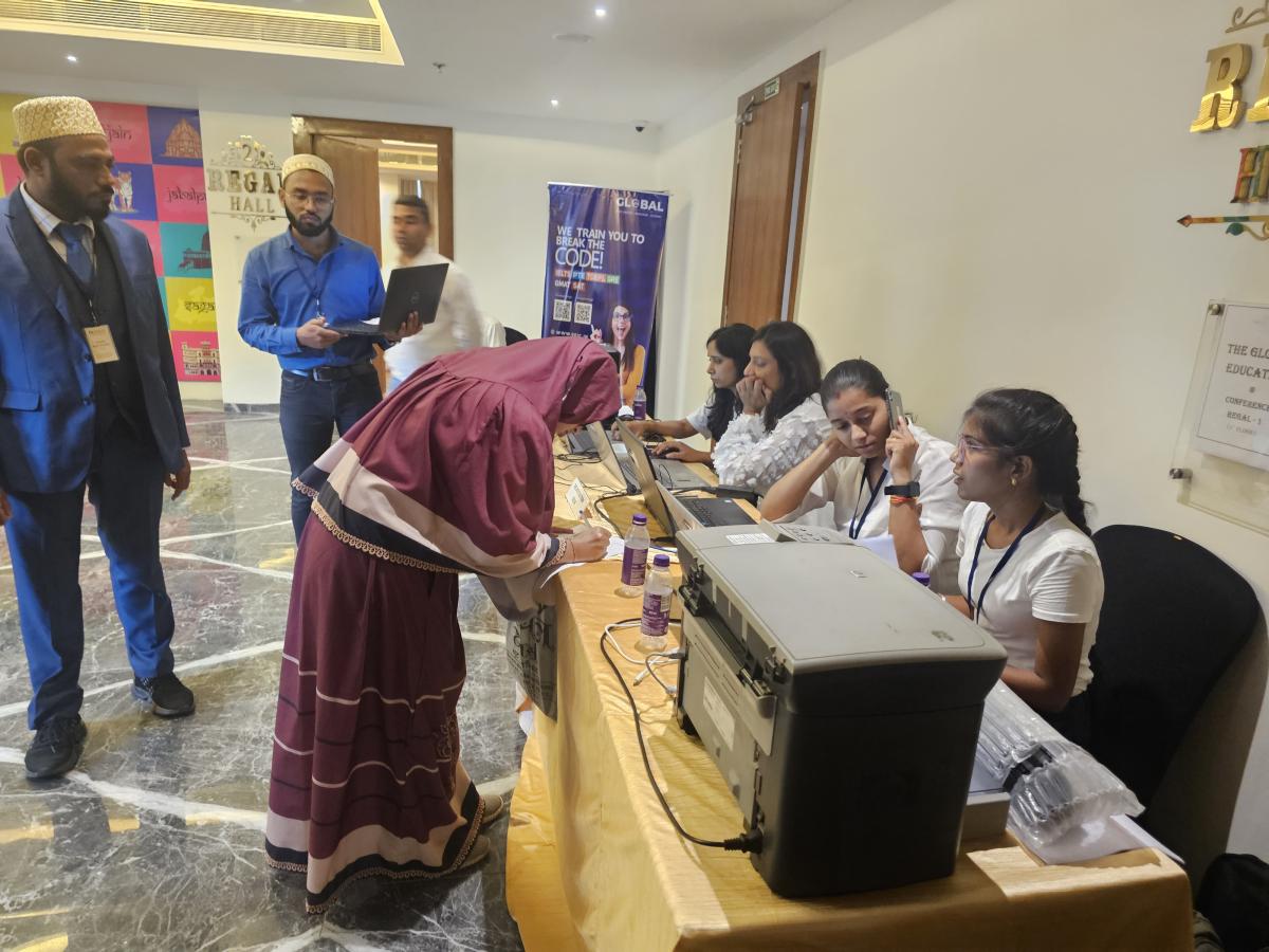Students checking in at a Trans Globe Indore education fair